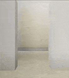 a video game character is laying on the floor in a hallway between two walls
