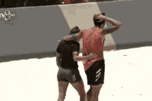 a man and a woman are hugging each other on a beach in front of a tv8 logo