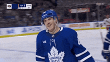 a hockey player for the toronto maple leafs smiles during a game