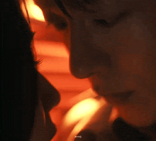 a close up of a man and woman 's faces .