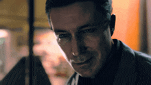 a close up of a man 's face with a serious look on his face