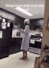 a woman standing in a kitchen with the words sleepovers with that one and on the bottom