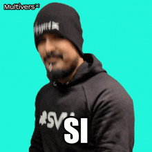 a man with a beard wearing a black hoodie and a black beanie says sv si