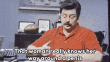 a man is sitting at a desk with the words that woman really knows her way around a penis