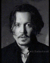 a black and white photo of a man 's face with the words " withahotrod " at the bottom of the photo