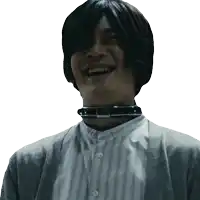 a man with a choker around his neck laughs with his eyes closed