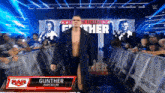 a wrestler named gunther imperium is walking down the ring