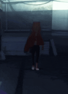 a blurry picture of a person standing in a dark room