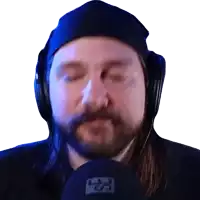 a man with a beard wearing headphones and a hat with the letter l on it