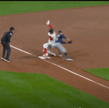 a baseball player wearing a red sox jersey is standing on the field