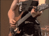 a man is playing a guitar with the word lucy on the neck