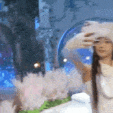a woman with long hair is taking a selfie in front of a mirror .