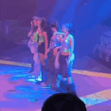 a person is covered in green slime while standing in front of a crowd