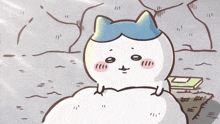 a cartoon drawing of a white cat with a blue hat