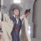 a man and a woman in traditional korean costumes
