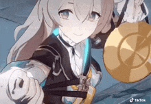 a girl from a video game is holding a gong in her hand .