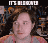 a close up of a man 's face with the words it 's deckover written above him