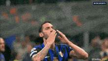 a soccer player wearing a shirt that says ' cbs sports ' on it
