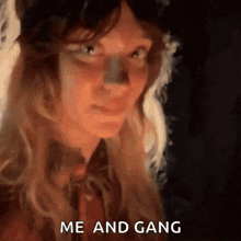 a close up of a woman 's face with the words me and gang above her