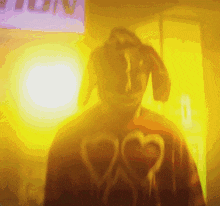 a blurry picture of a person wearing a red shirt with hearts on it