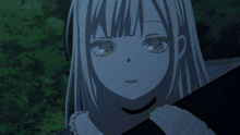 a close up of a girl 's face with the letter k visible