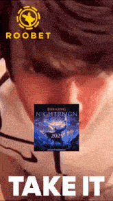 an advertisement for elden ring nightreign shows a man holding a poster