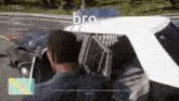 a screenshot of a video game shows a man in a police car with the word bro on it