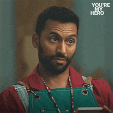 a man with a beard is wearing an apron and asking for suggestions