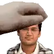 a hand is holding a man 's head in a pixel art style .