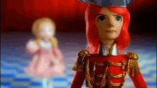a doll with red hair and a hat is standing next to a ballerina doll .