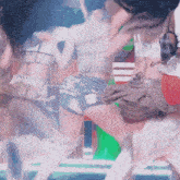 a group of women are dancing on a stage in shorts
