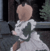 a girl in a maid costume has a name tag that says ' a ' on it
