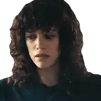 a close up of a woman 's face with curly hair and a black shirt
