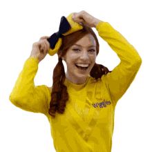 fixing hair bow emma wiggle the wiggles smiling happy