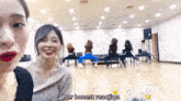 a group of women are sitting in chairs in a room and one of them says `` her honest reaction '' .