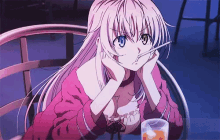 a girl with long white hair is sitting at a table with a glass of orange juice