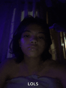 a girl is wrapped in a towel and the word lols is on the bottom