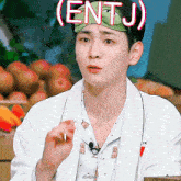 a young man wearing a headband that says entj on it