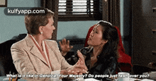 two women are sitting at a table and one of them is asking the other " what is it like in genovin your majesty "