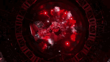 a red circle with a lot of lights on it in a dark room .