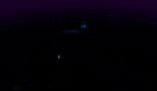a blurred image of a letter m in a circle on a dark background