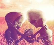 two aliens holding hands in a field with a sunset in the background