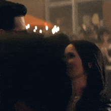 a man and woman are looking at each other and smiling