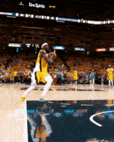 a basketball game is being played in a stadium that has the word spirits on it