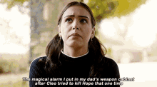 a woman is talking about the magical alarm she put in her dad 's weapon cabinet after cleo tried to kill hope that one time