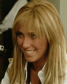 a close up of a woman 's face with blonde hair