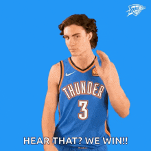 a man in a thunder jersey is covering his ears and saying hear that we win .