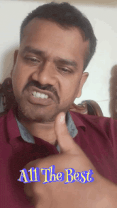 a man giving a thumbs up with the words " all the best " below him