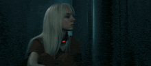 a woman with blonde hair and a red light around her neck