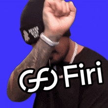 a man with a tattoo on his arm is wearing a black shirt and a black beanie and says go firi
